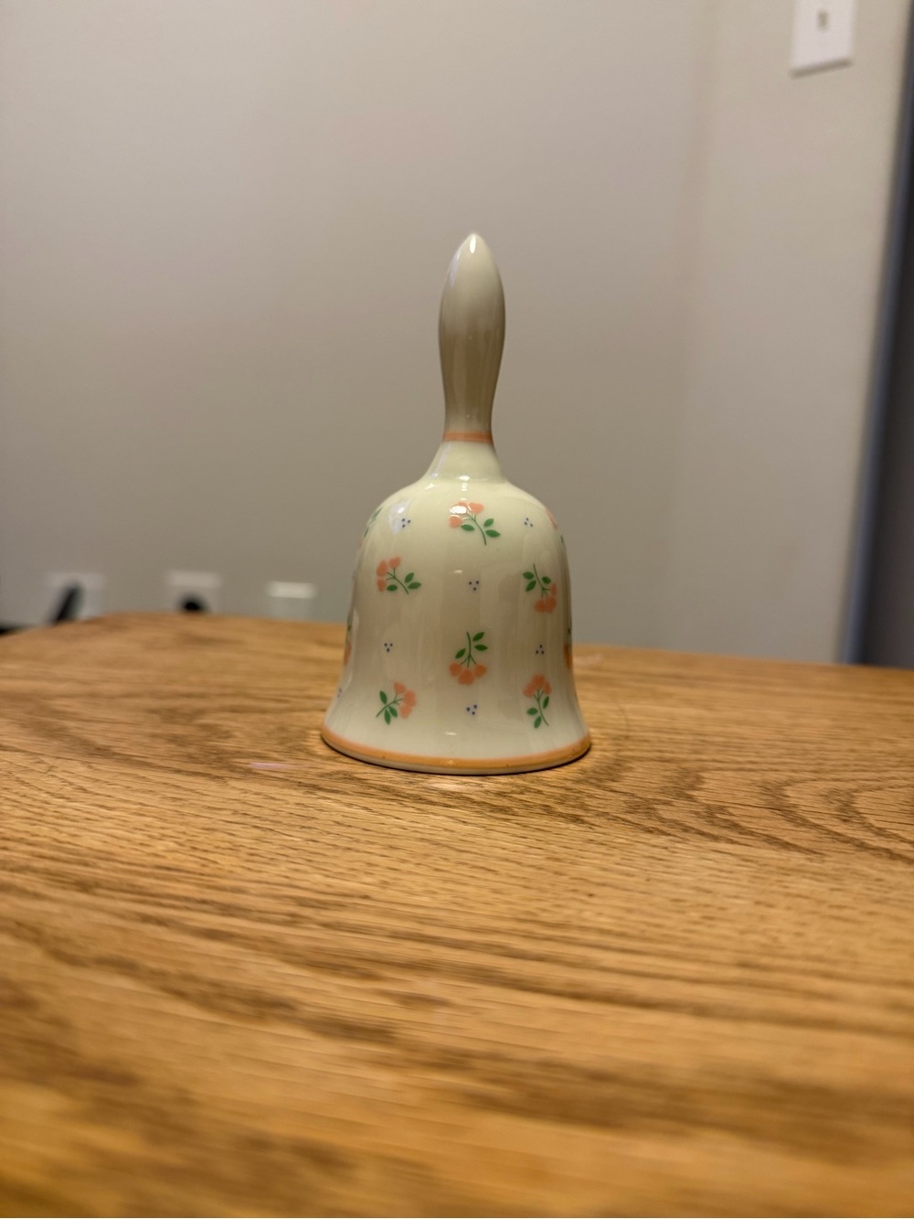 Cream Porcelain Hand Bell with Peach Floral Pattern
